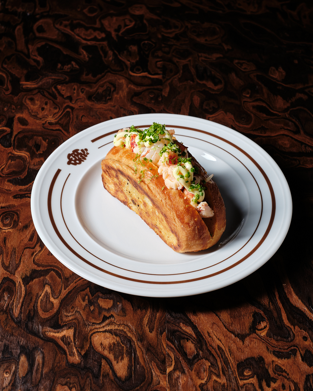 Fat Tony's lobster roll served on a plate